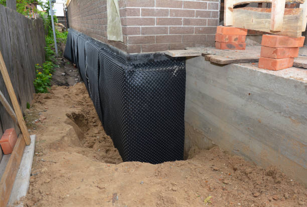 Happy homeowners after waterproofing job in McCalla